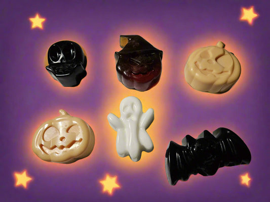 Halloween-themed soap figures on a halloween themed backround