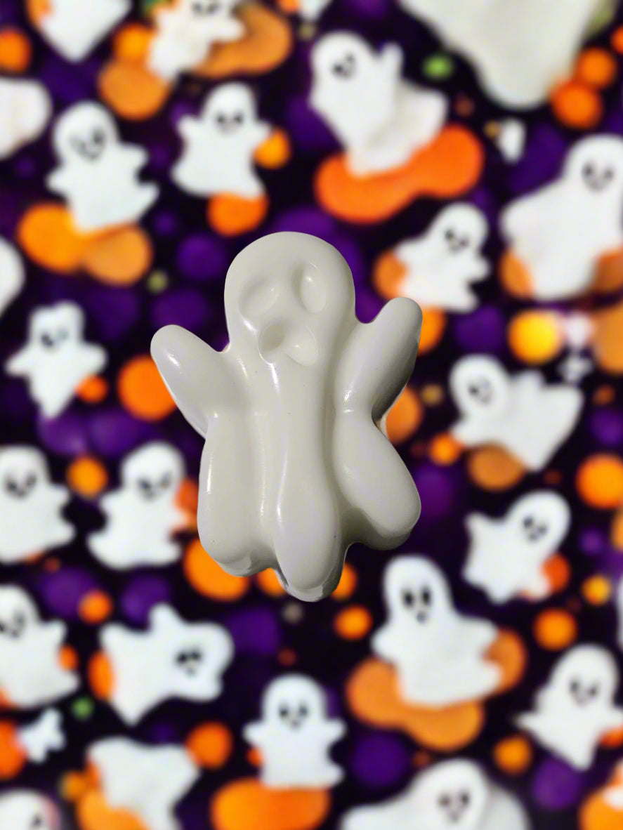 white ghost shaped soap on a Halloween themed background